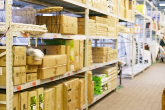 Warehouse racks with boxes, defocusing photo