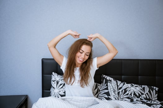 Beautiful caucasian woman at home in bed relaxing photo