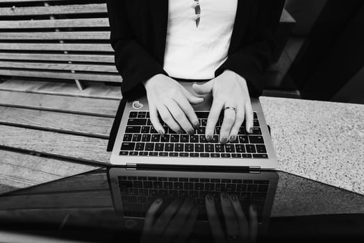 Close up image of woman hands typing on laptop. photo