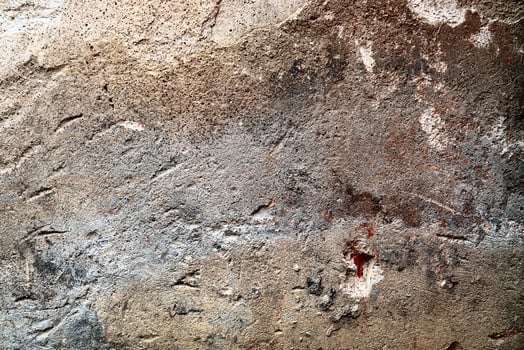 Detailed view on aged concrete walls with cracks and a lot of structure in high resolution photo