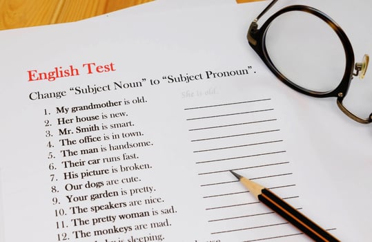 English test sheet on wooden desk photo