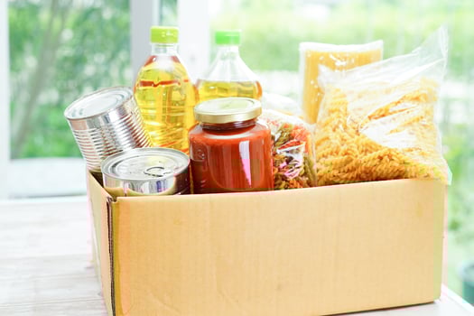 Foodstuffs in donation box for volunteer to help people. photo