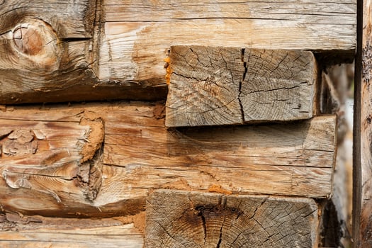 Log cabin. Wooden logs wall of rural house background photo