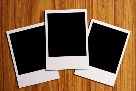 blank photos on a wood background