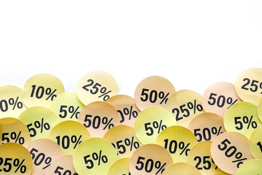 Large amount of stickers with yellow percentage values for black friday or cyber monday sale. Abstract image of discount prices photo