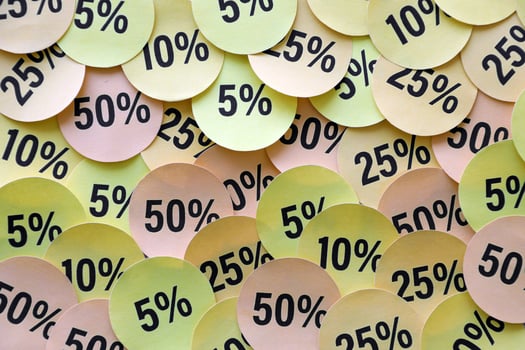 Large amount of stickers with yellow percentage values for black friday or cyber monday sale. Abstract image of discount prices photo