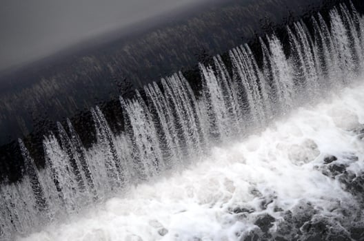 A picture of the flowing water. The dam is designed to regulate the water level in rivers within the city and to provide technical water to industrial objects photo