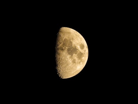 half moon in the dark sky photo