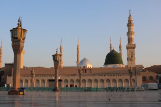 Medina, Saudi Arabia, Oct 2022 - Beautiful daytime view of Masjid Al Nabawi, Medina's green dome, minarets and mosque courtyard. photo