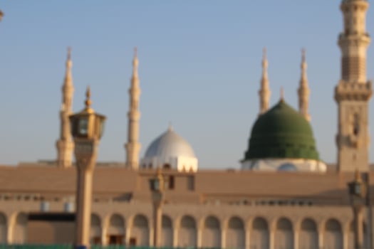 Medina, Saudi Arabia, Oct 2022 - Beautiful daytime view of Masjid Al Nabawi, Medina's green dome, minarets and mosque courtyard. photo