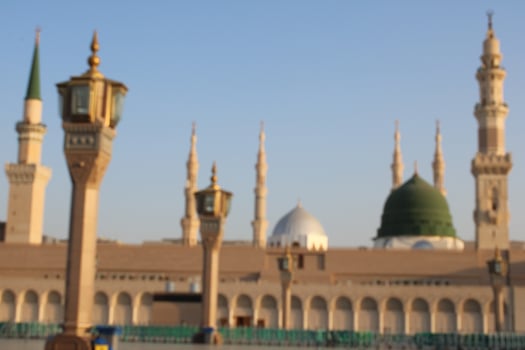 Medina, Saudi Arabia, Oct 2022 - Beautiful daytime view of Masjid Al Nabawi, Medina's green dome, minarets and mosque courtyard. photo