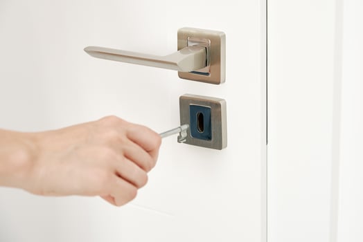Woman open keylock at room door photo