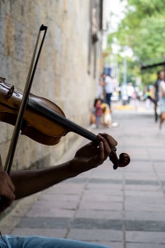 man playing the violin. Musical theme. male fingers grip the strings and hold the bow photo
