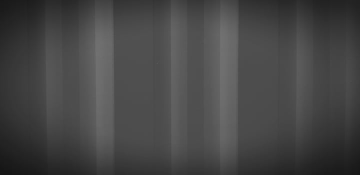 Dark gray or grey stainless steel background in vintage tone. Black shutter door wall with copy space. Line pattern of curtain or zinc wallpaper concept. photo