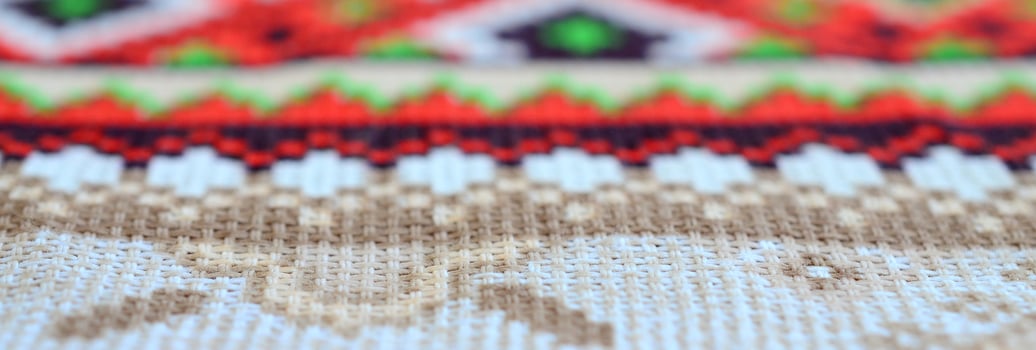 Traditional Ukrainian folk art knitted embroidery pattern on textile fabric photo