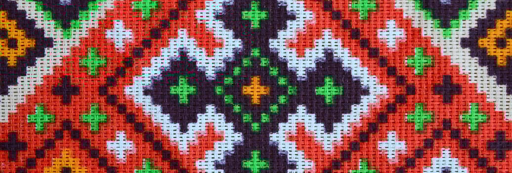 Traditional Ukrainian folk art knitted embroidery pattern on textile fabric photo