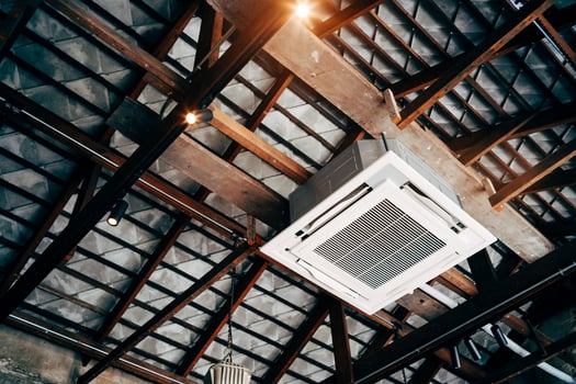 Ceiling mounted cassette type air conditioner. technology background photo