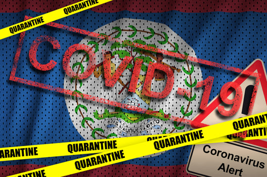 Belize flag and Covid-19 quarantine yellow tape with red stamp. Coronavirus or 2019-nCov virus photo