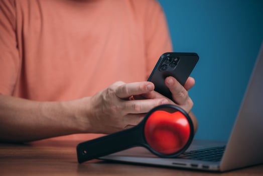 Online dating service searching concept. Man and woman hand with magnifying glass expand on red heart shape, search bar or search box on virtual screen, browsing Internet global data for love people. photo