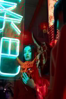 Anime woman in a red suit with short hair cut, black hair. A killer girl in a red jacket with a red Japan mask. Beauty portrait photo