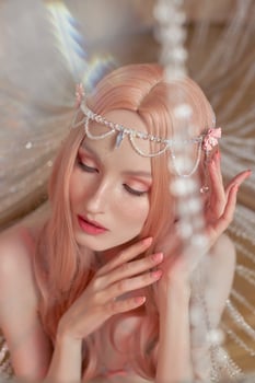 Beauty portrait of anime princess elf woman with pink hair in underwear. Fabulous magical look, beautiful pink makeup. Rim crown on the head of a woman photo