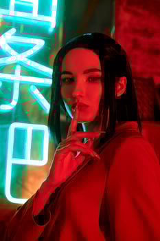 Anime woman in a red suit with short hair cut, black hair. The killer girl in the red jacket. Beauty portrait photo