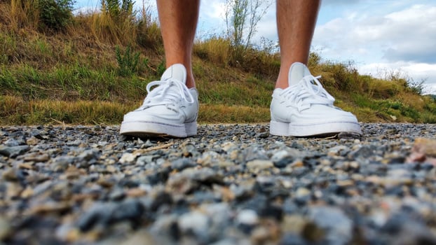 Closeup of feet in white shoes 1 photo