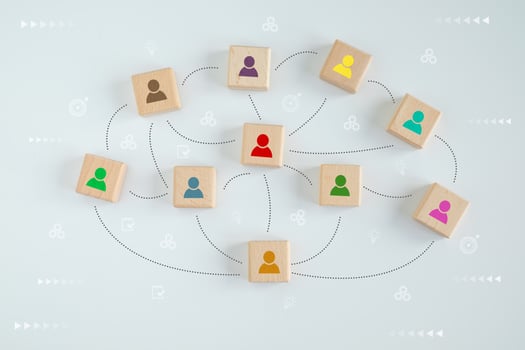 Many human icon on wooden blocks with line connection symbol for spread influence to people through a communication network. Social connections. Coordination. Teamwork. Building a strong team. photo