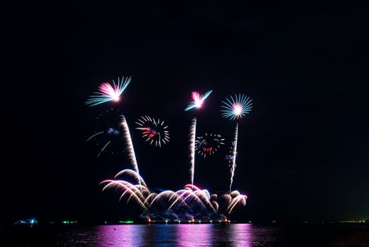 fireworks celebration over sea in pattaya beach photo
