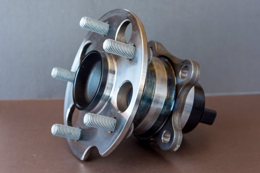 Rear wheel hub assembly with ABS sensor on a colored background, auto parts, bearing photo