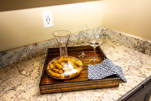 Kitchen Granite Counter Top with Wooden Tray With Glasses And Decanter photo