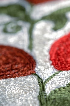 A closeup shot of national ornaments and patterns of Central Asia on a piece of cloth photo