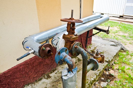 Iron old rusty corrosion-proof industrial metal pipes with flanges valves transitions and branches for the oil and gas petrochemical industry photo
