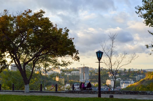 people rest in the park on the background of the city photo