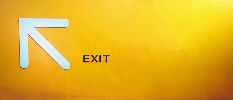 White arrow sign give direction to go up, entrance, exit or way on yellow concrete wall with copy space. Traffic symbol for tell car or people on, street, road or in building on painted background. photo