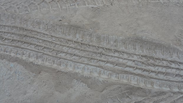 The car tyre print on the muddy road photo