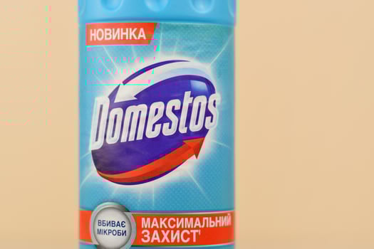 KHARKIV, UKRAINE - MAY 2, 2021 Domestos Blue bottle. Domestos is a household cleaning range which contains bleach manufactured by Unilever photo