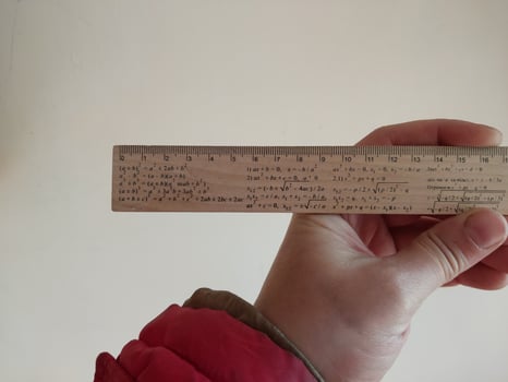 Slide rule in human hand photo