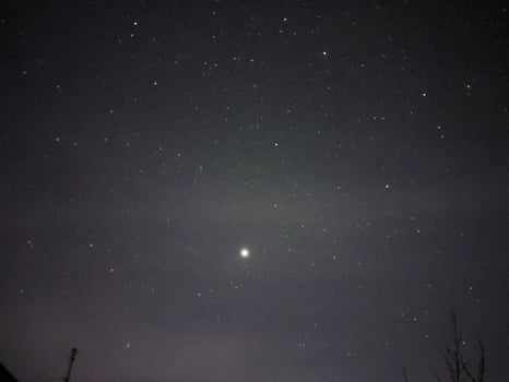 Bright night starry sky in the village photo