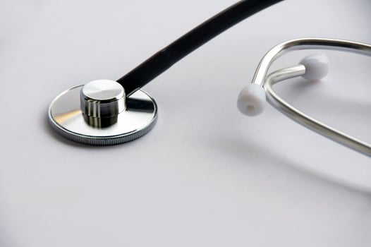Stethoscope on white cover background with customizable space for text. Copy space and health concept photo