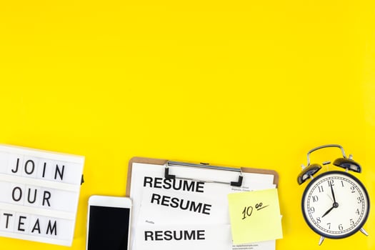 Join our team flat lay on yellow background photo