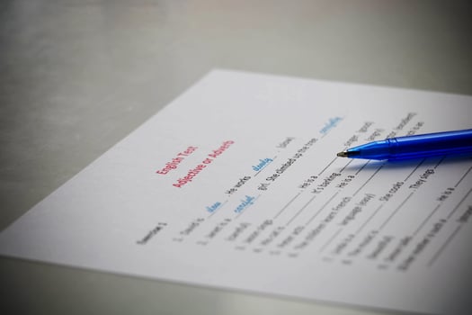 hand holding blue pen photo