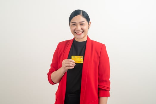 Asian woman holding credit card with white background photo