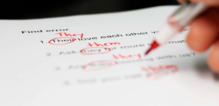 proofreading paper on table photo