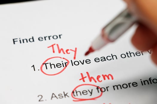 proofreading paper on table photo