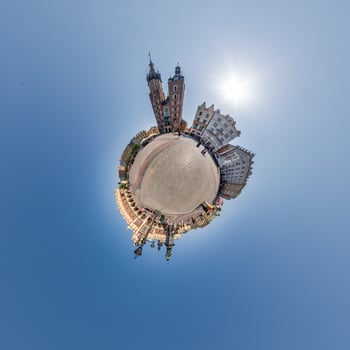 Little planet and spherical aerial 360 panorama view on street ancient medieval city with church and historic buildings photo