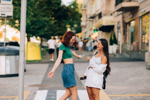 Happy meeting of two friends hugging in the street photo