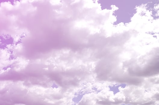 A blue sky with lots of white clouds of different sizes photo