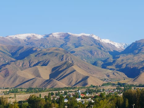 Landscape near Cholpon Ata, Kyrgyzstan, with mountains in the background photo