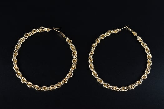 Jewelry earrings and costume jewelry on a black background photo